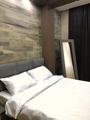 Appartement Deluxe, 4 chambres | 4 chambres, coffre-fort, bureau, fer et planche à repasser