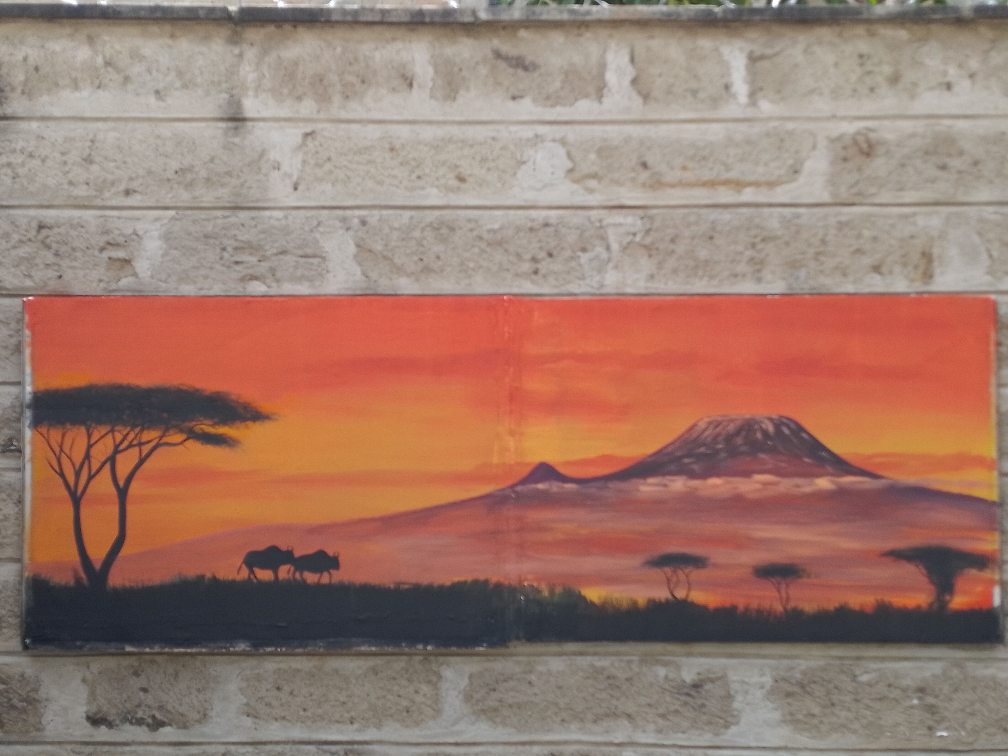 Una pintura de una montaña al atardecer con árboles y animales.