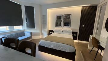 Premium bedding, memory-foam beds, blackout curtains, iron/ironing board
