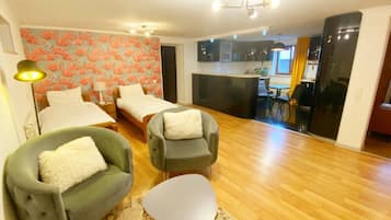 Deluxe Suite | Living area | Netflix, streaming services, printers