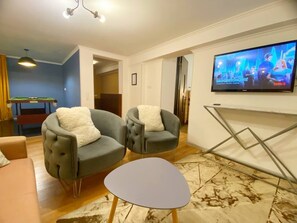Deluxe Suite | Living area | Netflix, streaming services, printers