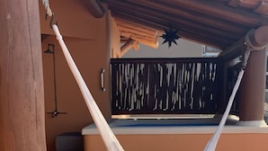 A hammock hanging between two wooden pillars on a tiled patio. - March Break Mexico Getaway
2 Bedroom Beach front Vacation Home
Sleeps 6 (Zihautanejo)