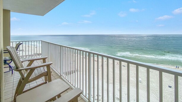 A balcony with a view of the ocean and beach. - "Seaside Bliss: Beachfront Condo with Stunning Ocean-View Balcony!" (Orange Beach)