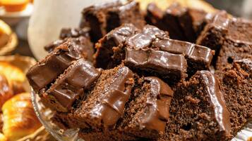A glass plate with chocolate brownies.