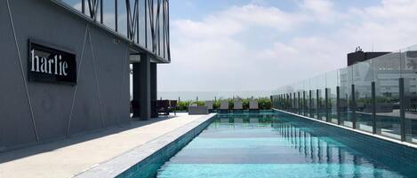 Outdoor pool, open 9:00 AM to 9:00 PM, pool loungers
