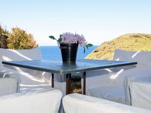 Outdoor dining - Stylish house next to a secluded beach offering amazing sunset views  (Kea)