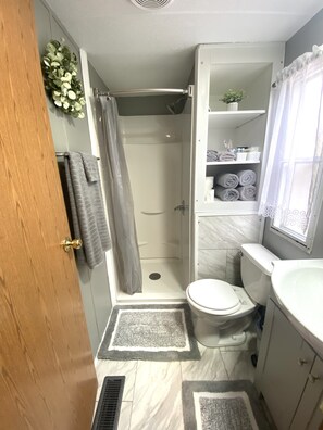 Shower, hair dryer, towels, soap