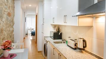 Design Apartment | Private kitchen | Full-size fridge, microwave, oven, stovetop