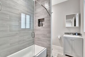 Shower, rainfall showerhead, hair dryer, towels