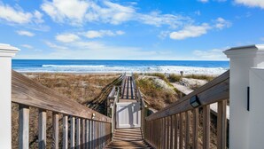 A wooden boardwalk leading to a beach with a clear sky. - Kure Beach Ocean View, Pool & Beach Access (Kure Beach)
