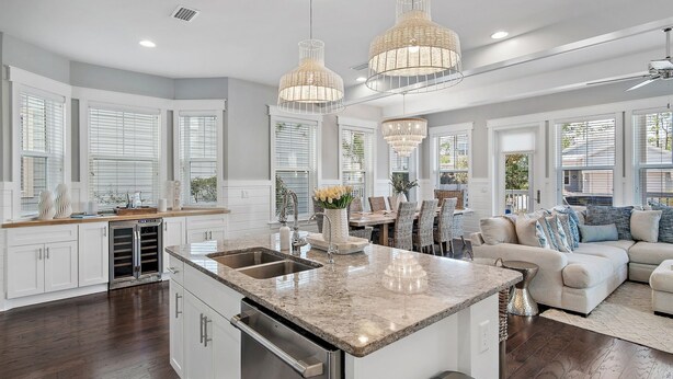 A spacious kitchen with a central island, large windows, and modern pendant lighting. - Rosé Sunsets 6 Seaters Golf Cart and 5 Bikes, Heated Resort Pools, Pickleball Courts (Santa Rosa Beach)