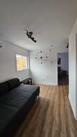 Apartamento conforto | Área de estar | Smart TV 43 polegadas com canais digitais, Netflix, Hulu