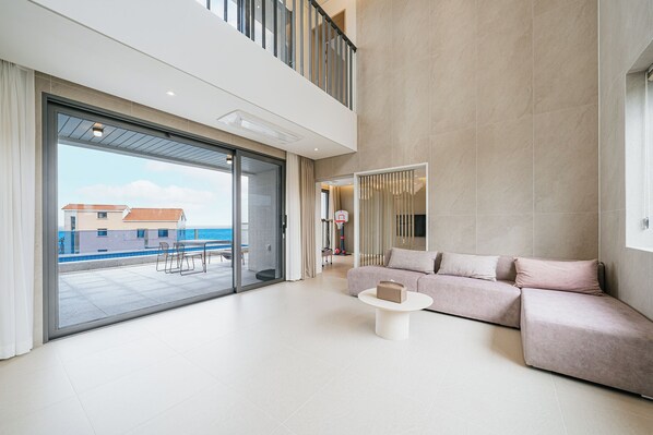 Luxury Duplex, 2 Bedrooms, Private Pool, Ocean View | Living room | 50-inch LED TV with cable channels, Netflix, heated floors