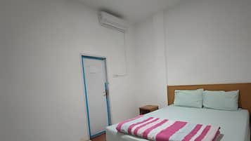 Desk, laptop workspace, bed sheets