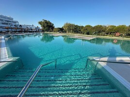 Outdoor pool, pool umbrellas, sun loungers