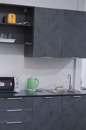 Toaster, rice cooker, cookware/dishes/utensils, cleaning supplies