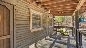 A wooden cabin with a porch, a window, and a door. - Blairsville Cabin w/ Fire Pit, 7 Mi to Dtwn! (Blairsville)