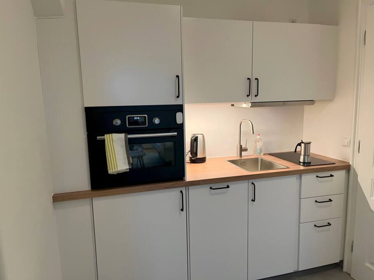 Fridge, coffee/tea maker, cookware/dishes/utensils