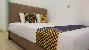 Desk, laptop workspace, bed sheets