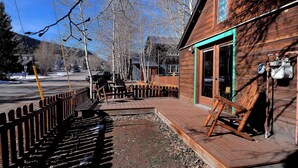 A wooden building with a porch, a fence, and a bench. - "Wild Iris" Historic Home in downtown CB, Dog Friendly! (Crested Butte)