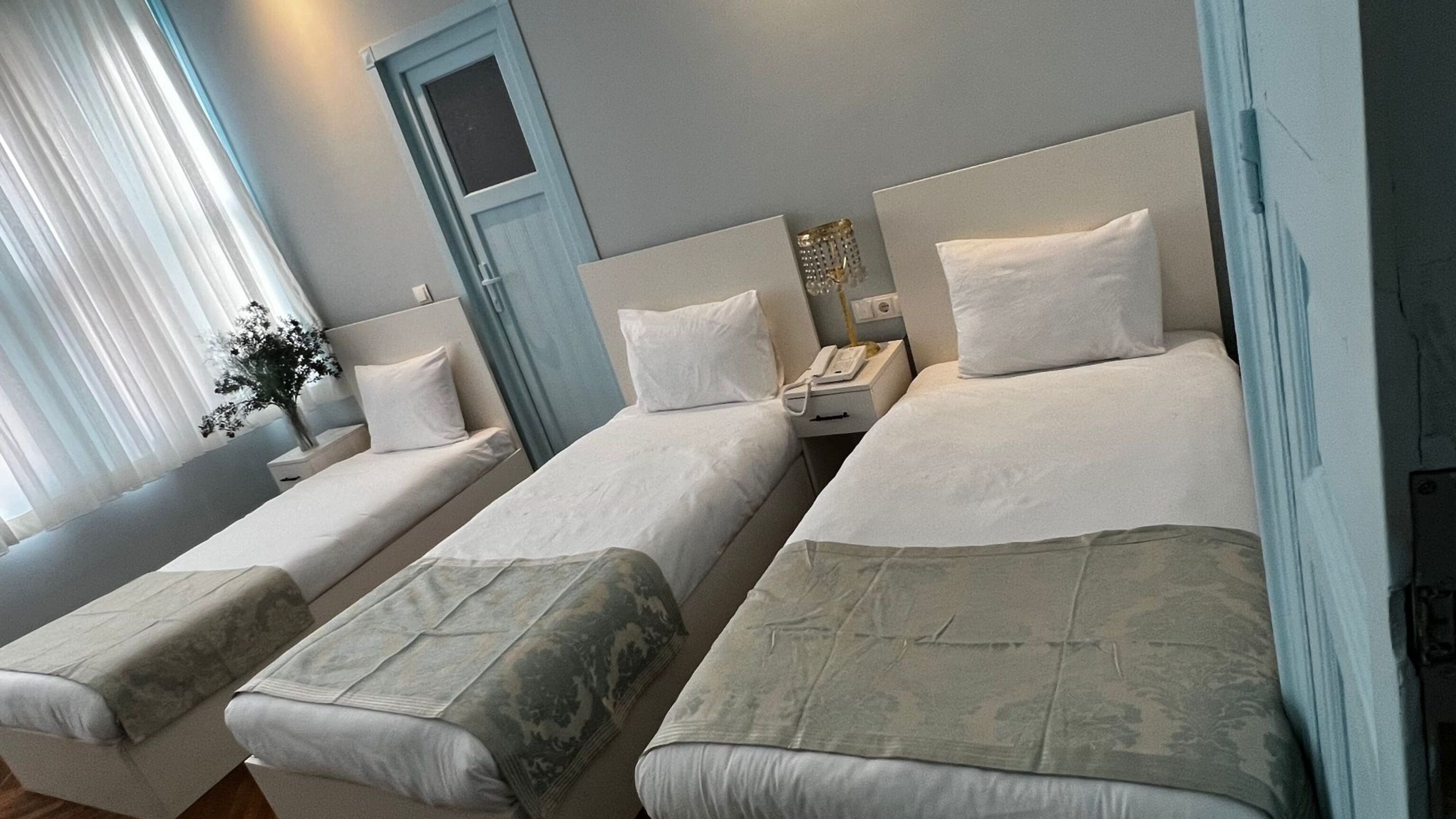 Standard Triple Room | Minibar, in-room safe, desk, free WiFi