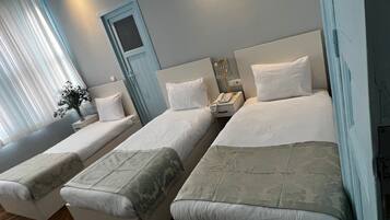 Standard Triple Room | Minibar, in-room safe, desk, free WiFi