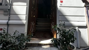 A hotel entrance with a wrought iron balcony, a sign reading "Bali AP. N94", and a "B5" sign indicating the hotel name. - Bali Star City Hotel (Istanbul)