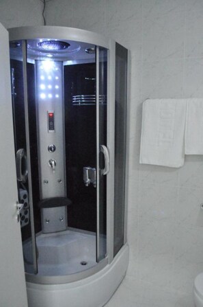 Shower, hair dryer, towels, soap