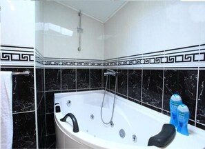 Jetted tub, hair dryer, towels, soap