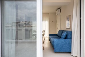 Penthouse, Balcony | Living area | LED TV - Kallithea Apartments by Olala Homes (Kallithea)