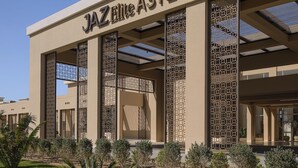 A building with the sign "JAZZ Elite Asteria" indicating a hotel or resort.