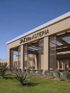 A building with the sign "JAZZ Elite Asteria" indicating a hotel or resort.