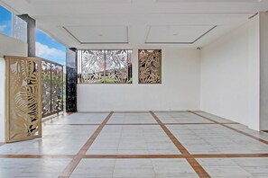 Experience the serene atmosphere of this minimalist space, featuring a large, open floor plan and a stunning gallery showcasing intricate cut-out designs.
