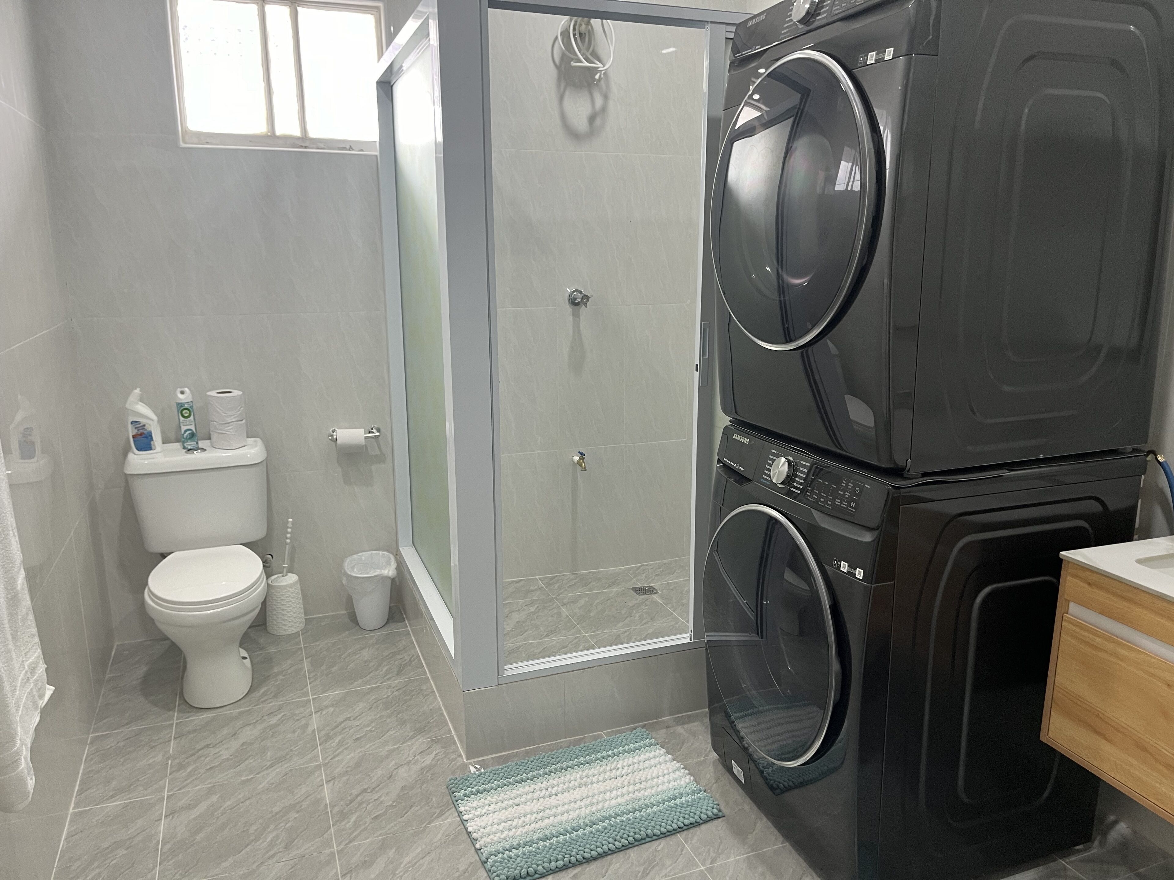 Shower, hair dryer, towels, soap