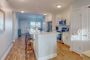 Fridge, microwave, oven, stovetop - Charming stay near the sea with balcony, open layout, smart TVs, & W/D (Mexico Beach)