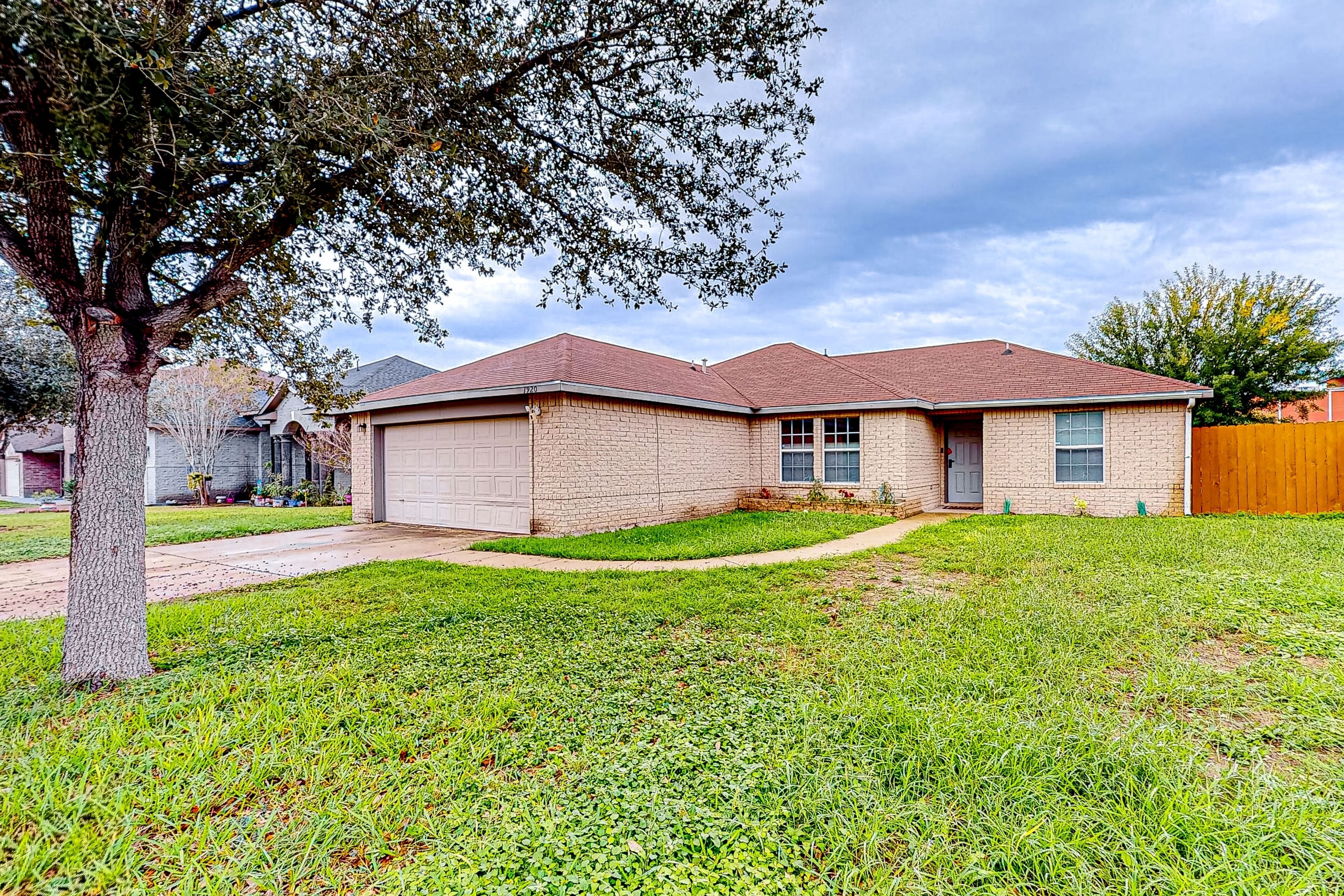 Single-story home with private yard, updated interior, AC, & W/D