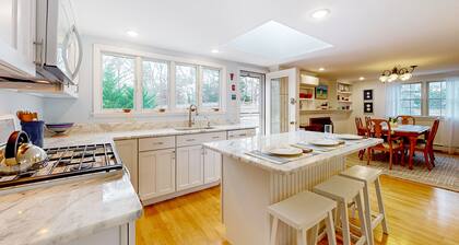 Tranquil & sunlit home with peaceful yard, large deck, & fireplace - near beach