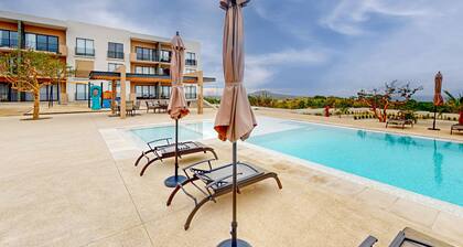 Gorgeous dog-friendly apartment with balcony, open layout, heated pool, & AC