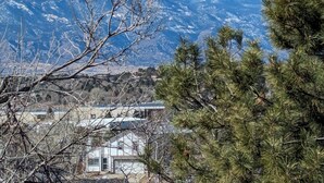A mountainous landscape with snow-capped peaks under a clear blue sky. - Pet Friendly, Mountain View Home with Park/Playground Access  *see description* (Colorado Springs)