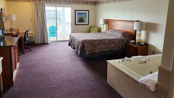 Habitación individual Premium, 1 cama King size, hidromasaje | Escritorio, tabla de planchar con plancha, wifi gratis y ropa de cama