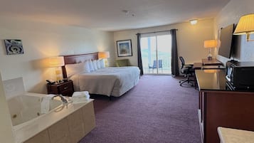 Habitación individual Premium, 1 cama de matrimonio grande, bañera de hidromasaje | Escritorio, tabla de planchar con plancha, wifi gratis y ropa de cama