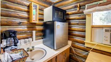 Fridge, microwave, coffee/tea maker, cookware/dishes/utensils