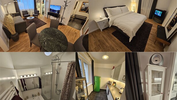 Ein Hotelzimmer mit Bett, Fernseher, Schreibtisch und Bad.