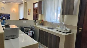Fridge, microwave, oven, stovetop - Family-sized Two Bedroom Apartment few minutes drive to the beach (Bamburi)