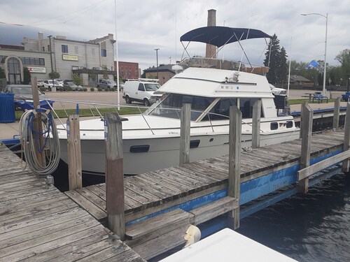 30' CARVER BOAT DOCKED AT MENOMINEE MARINA IN HISTORIC DOWNTOWN MENOMINE MI.