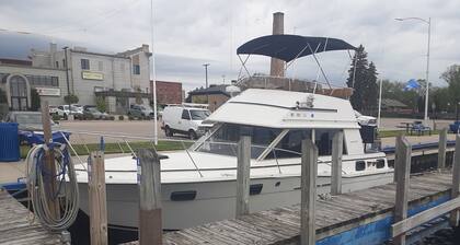 30' CARVER BOAT DOCKED AT MENOMINEE MARINA IN HISTORIC DOWNTOWN MENOMINE MI.