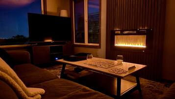 Smart TV, fireplace, DVD player, books