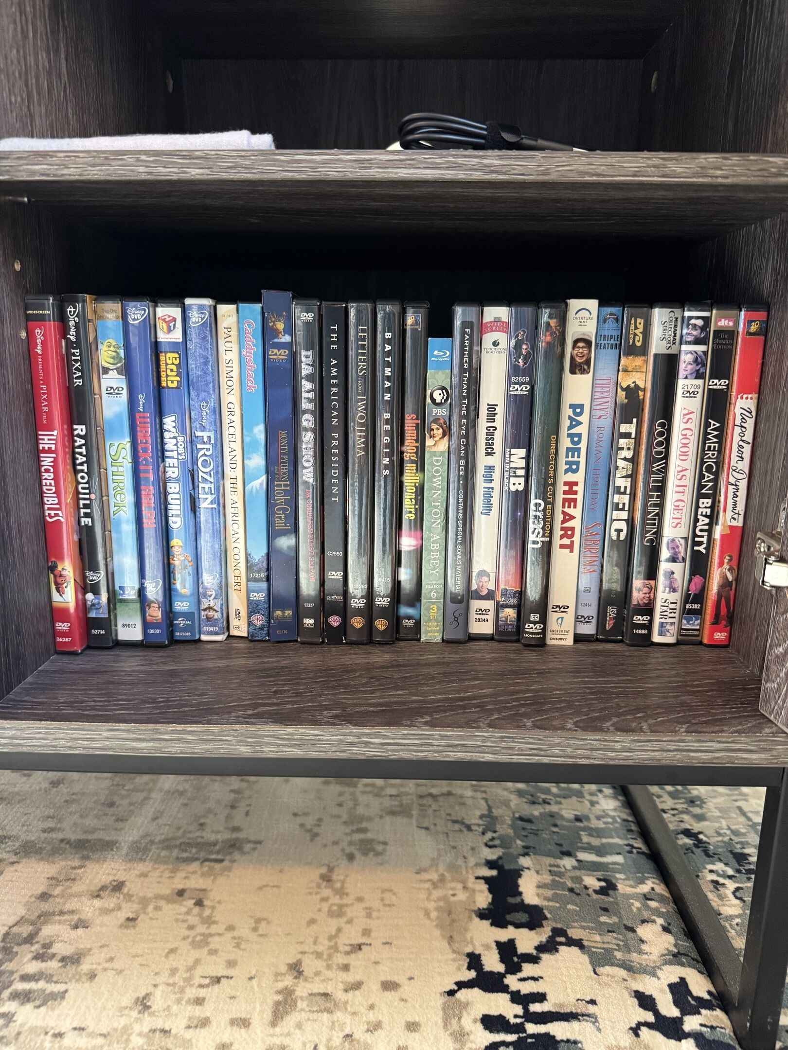 A bookshelf with DVDs and Blu-rays.