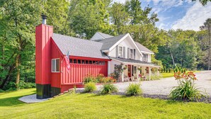 A two-story house with a red garage and a covered porch. - Duplex Unit, 2 Mi to Chittenden Reservoir! (Chittenden)