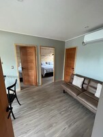 Deluxe Quadruple Room | Living area